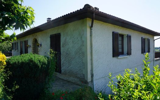 One-storey house with body of water.