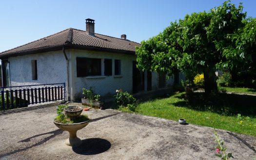 One-storey house with body of water.