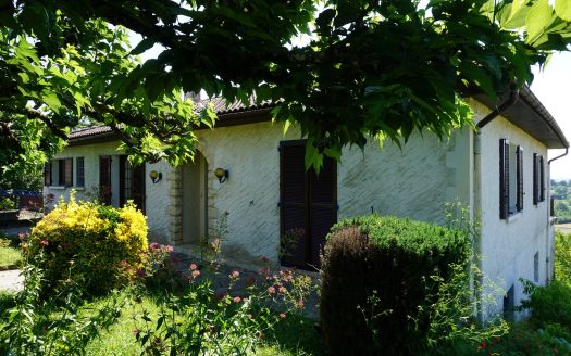 One-storey house with body of water.