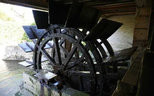 Authentic 19th century water mill with its paddle wheel.