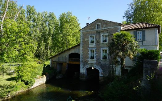 Authentic 19th century water mill with its paddle wheel.